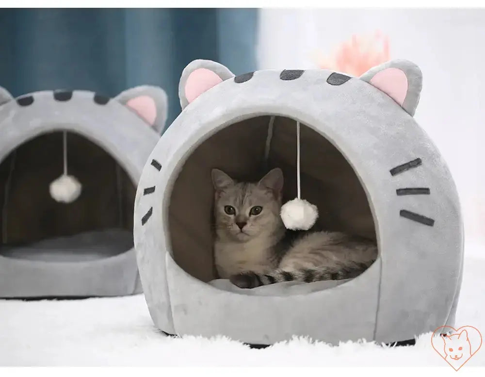 Cozy Super Cat Bed featuring a playful hanging toy, perfect for cats to relax and play in.