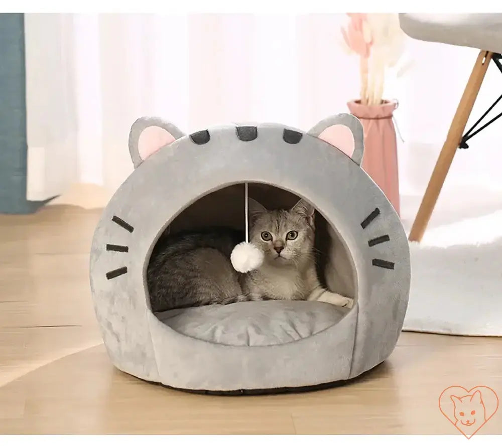 Cozy gray Super Cat Bed with hanging toy, featuring a cat comfortably relaxing inside.