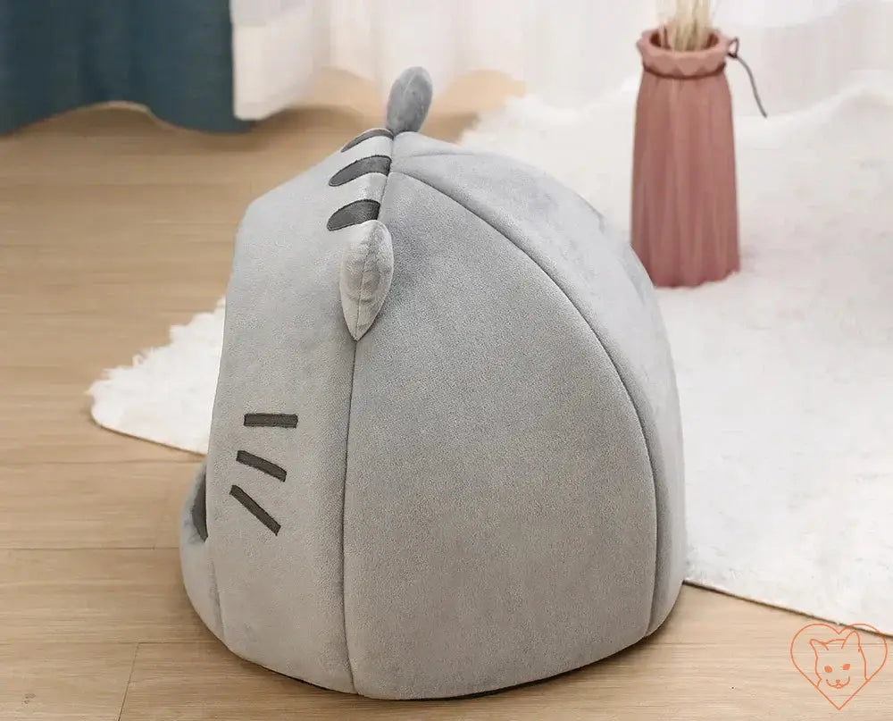 Cozy gray cat bed shaped like a cave, perfect for feline relaxation and comfort, with cute facial details.