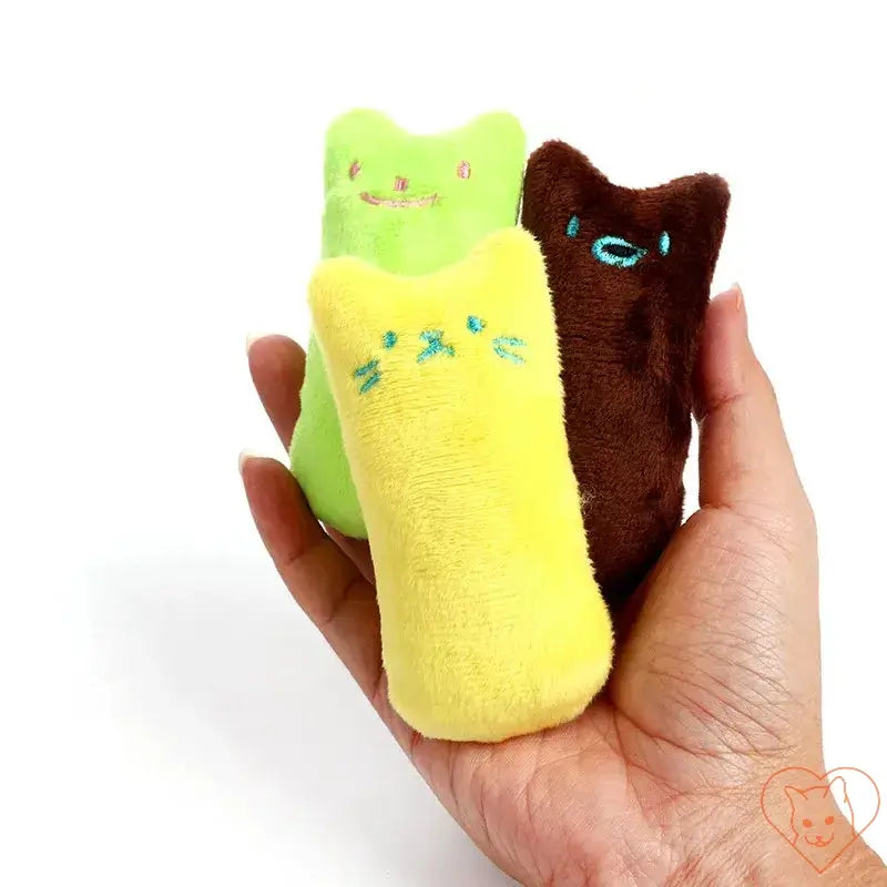 Three colorful plush catnip chew toys held in a hand, perfect for engaging and entertaining playful cats.