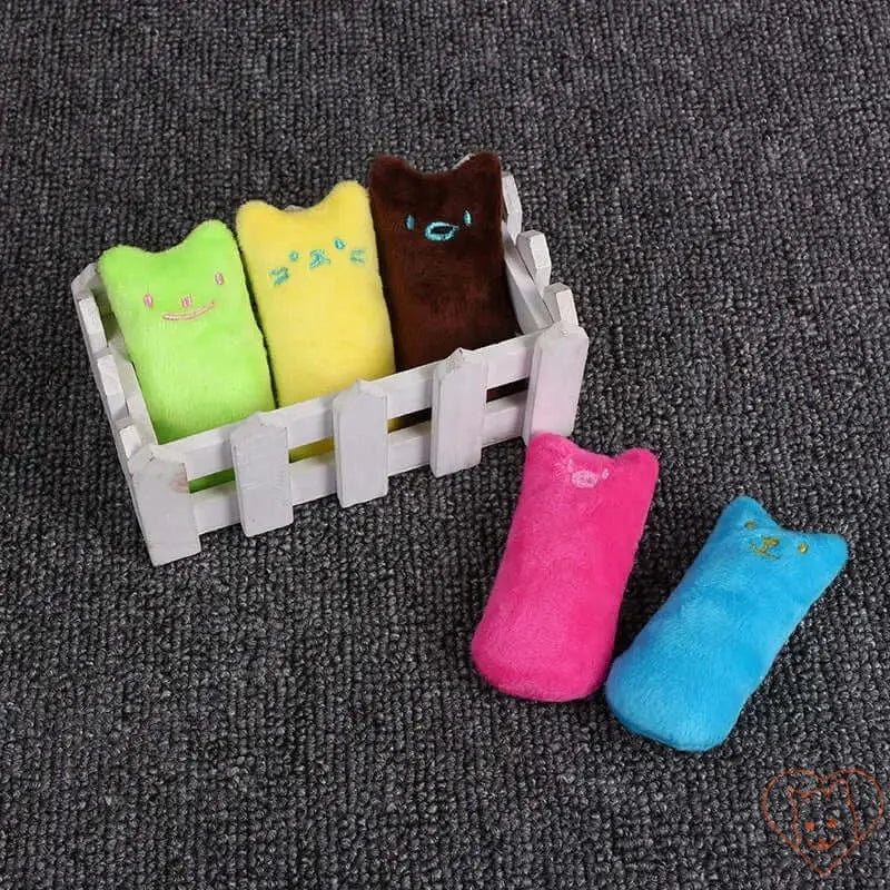 Interactive plush catnip chew toys in bright colors, perfect for keeping cats entertained and promoting dental health.