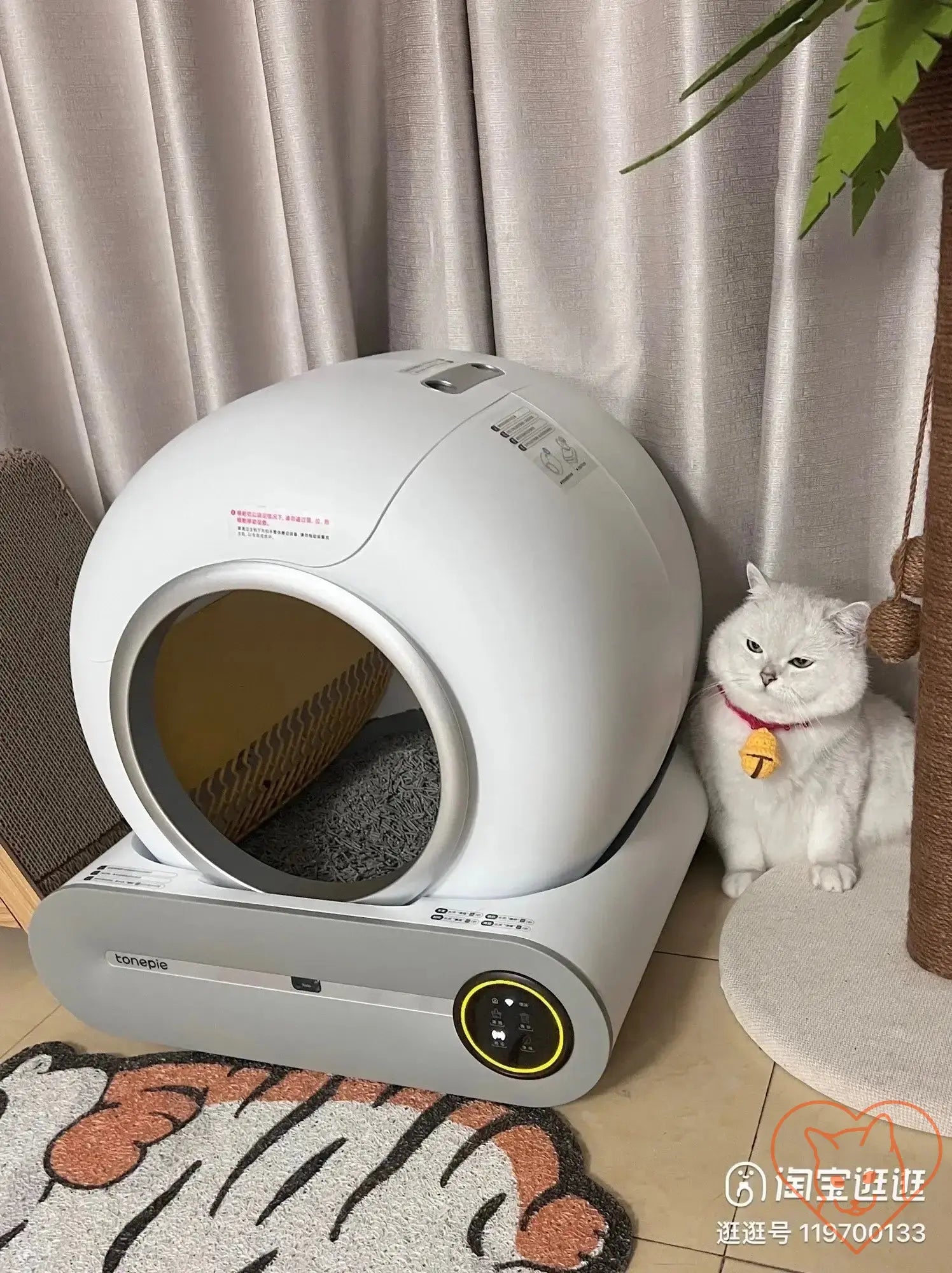 Tonepie 65L Automatic Smart Cat Litter Box next to a fluffy cat, featuring a modern design for self-cleaning and odor control.