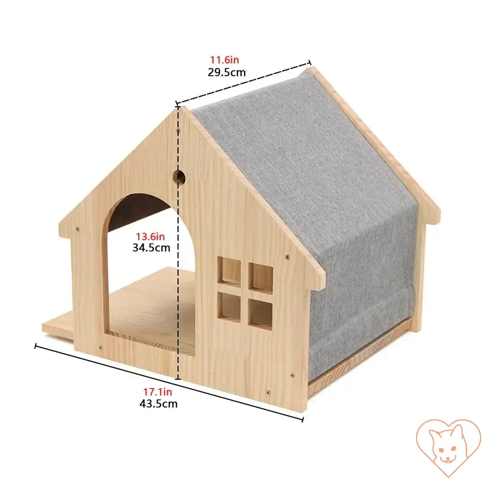 Wooden cat house with grey fabric roof, featuring a window and seating area, perfect for feline relaxation.