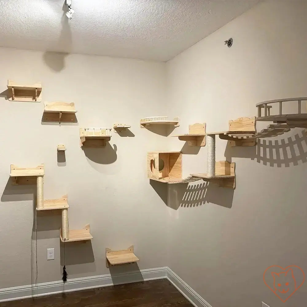 Wall-mounted cat climbing shelves featuring a bridge, hammock, and scratching post for feline play.