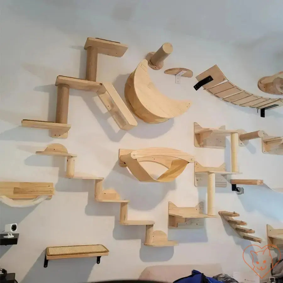 Wall-mounted cat climbing shelves with bridge, hammock, and scratching post in a stylish interior.