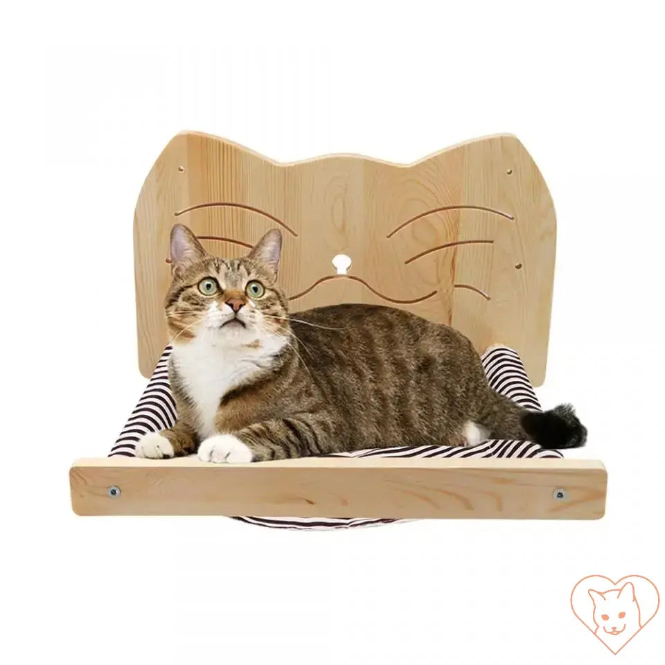 Cat lounging on a Wall-Mounted Cat Hammock with a wooden cat-shaped backing, perfect for climbing and scratching.