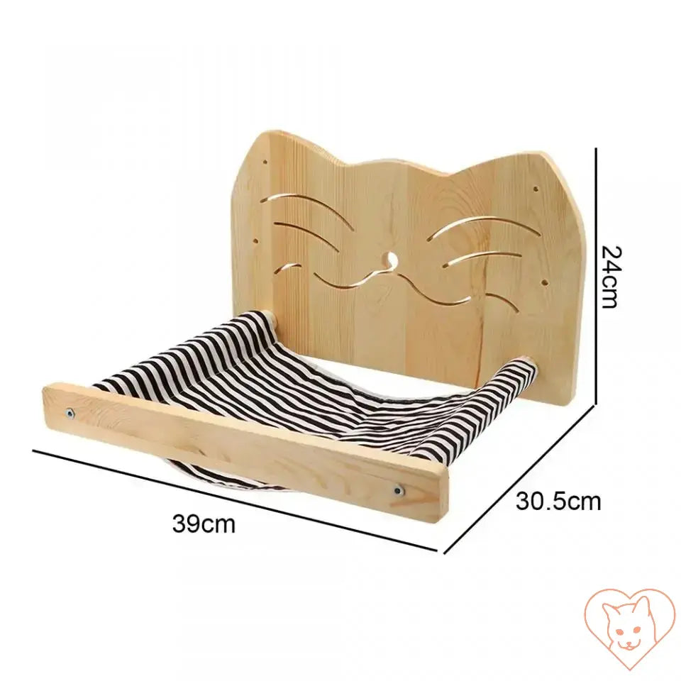 Wall-mounted cat hammock with wooden frame and striped fabric for scratching and lounging.