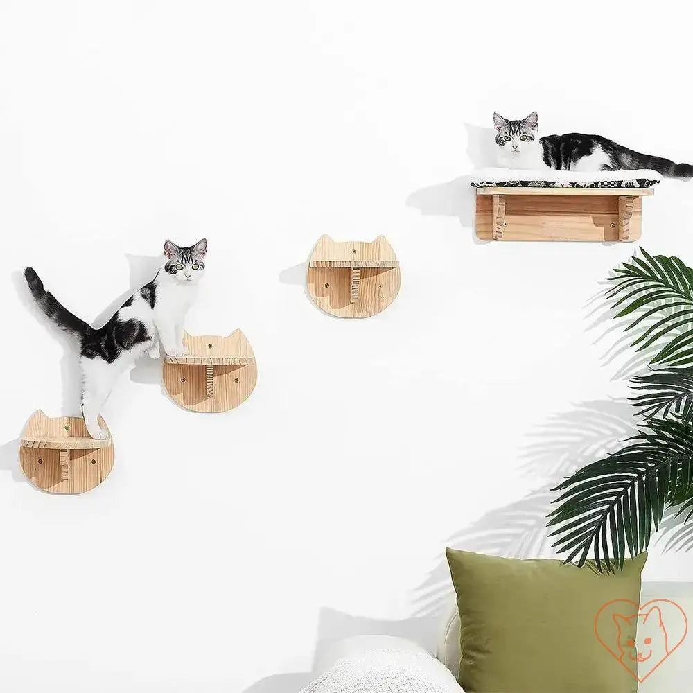 Two playful cats on a wall-mounted cat tree with climbing shelves and hammock for comfort and fun.