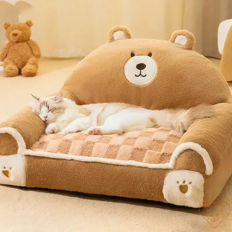 Cozy Winter Plush Cat Bed in bear design, featuring a sleeping cat on a soft, plush sofa for ultimate comfort.