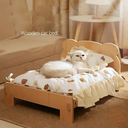 Cozy wooden cat bed with teddy bear pattern, featuring a relaxed cat on a soft cushion. Perfect for pets!