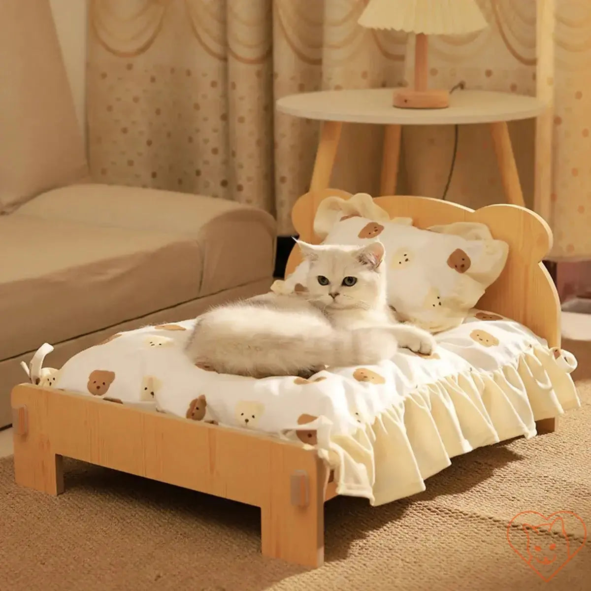 Cozy wooden cat bed with teddy bear pattern, featuring a soft cushion and a cute cat relaxing on it in a stylish room.